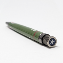 Load image into Gallery viewer, Angled top view of the pen. The top disk has a navy blue background with a white five-point star.