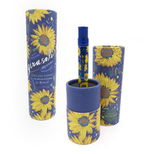 Load image into Gallery viewer, The pen placed on the bottom of the gift tube, which doubles as a pen stand. The cover is set to the right, and a closed gift tube is set to the left on a white background.