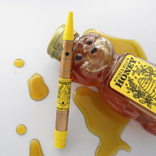 Load image into Gallery viewer, Back view of the pen leaning on the bear-shaped honey bottle.
