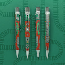 Load image into Gallery viewer, The Retro 51 Limited Edition Lionel Trains Christmas Light Express - the image shows the pen photographed from 4 different angles. From left to right: the pen is sideways, clip is facing right, and reads Seasons Greetings in festive green lettering, the second pen the clip is facing front and we can see the front of the locomotive, in the third image the clip is facing left and reads Seasons Greetings in festive green lettering, and the last image shows four wheels of the train in silver.