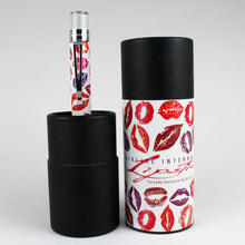 Load image into Gallery viewer, The pen arranged with the presentation tube and lid on light gray background.