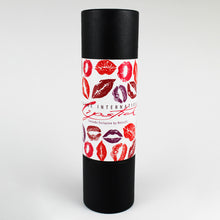 Load image into Gallery viewer, Front view of the gift tube with kiss marks on the tag.