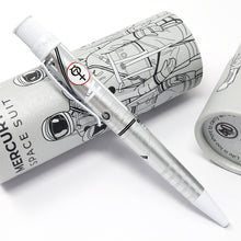 Load image into Gallery viewer, Side view of the Mercury 7 pen leaning on the gift tube. The Mercury 7 logo is visible on the side of the clip.