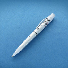 Load image into Gallery viewer, Angled view of the Retro 51 Mercury 7 Rollerball Pen on a blue background.