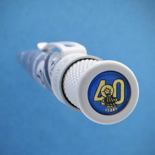 Load image into Gallery viewer, Close up to the top disk of the Mercury 7 Retro 51 Pen. It has the graphic of a shooting star and 40 Years