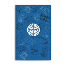 Load image into Gallery viewer, Front cover of the PanAM notebook. it is royal blue with a faded white grid, and different passport stamps.