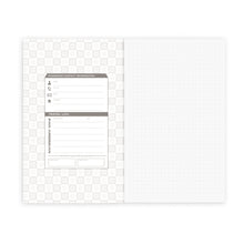 Load image into Gallery viewer, Inside view of the PanAM notebook. it has a section for contact information on the inside of the cover, and the paper is a dot grid.