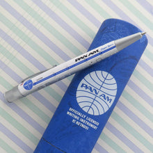Load image into Gallery viewer, Side view of the pen leaning on the blue gift tube.