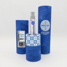 Load image into Gallery viewer, Side view of the pen arranged with two matching gift tubes on a white background.