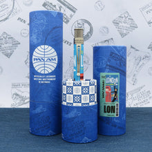 Load image into Gallery viewer, The rollerball pen arranged with matching gift tubes on a decorated blue and white background.