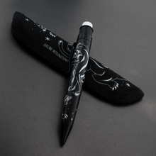 Load image into Gallery viewer, Side view of the mechanical pen leaning on the matching protective sleeve.