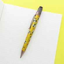Load image into Gallery viewer, Side view of the mechanical pencil, on a yellow background and white grid paper notebook.