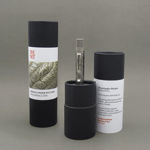 Load image into Gallery viewer, The rollerball pen arranged with the gift tubes on a light gray background.