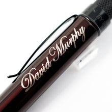 Load image into Gallery viewer, Engraving Sample on Tornado Stealth Lacquer in Dark Cherry - Close-Up to the sample name engraving.