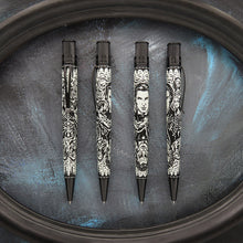 Load image into Gallery viewer, Front, back, and side view of the Picture of Dorian Gray pens on a dark background within an oval shaped frame.