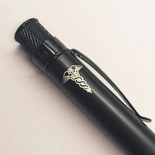 Load image into Gallery viewer, Retro 51 Stealth Black Matte rollerball with Caduceus engraving on a light background.