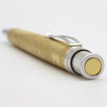 Load image into Gallery viewer, A close-up of the top disc of the pen with a textured metallic cap and chrome accents, photographed on a white background.