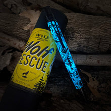 Load image into Gallery viewer, Wolf Rescue pen with blue glow in the dark feature on wooden background