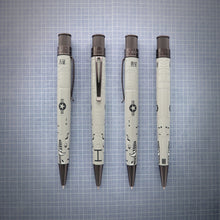 Load image into Gallery viewer, Front, back and side views of the Retro 51 A-10 Warthog Rollerball Pen. Set on a white and blue grid.