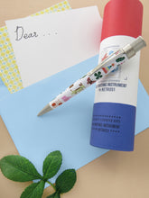 Load image into Gallery viewer, Retro 51 USPS® Thinking of You Stamp 2023 Rollerball Pen with Presentation Tube, and giftcard background.
