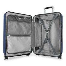 Load image into Gallery viewer, Interior view of the blue suitcase. It features a zipper-closing panel divider and adjustable straps.