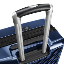 Load image into Gallery viewer, Angled close up to the blue suitcase's top panel. The handle is extended.