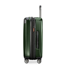 Load image into Gallery viewer, Side panel view of the green hard shell suitcase. It features a grab handle.