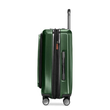 Load image into Gallery viewer, Side panel view of the green hard shell suitcase. It features a grab handle.