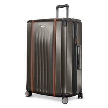 Load image into Gallery viewer, Angled front panel view of the graphite hard shell suitcase.
