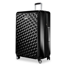 Load image into Gallery viewer, Angled front panel view of the black hard shell suitcase.