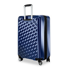 Load image into Gallery viewer, Angled back panel view of the blue hard shell spinner suitcase.