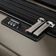 Load image into Gallery viewer, Close up to the bronze suitcase's TSA Approved, three-digit combination lock.