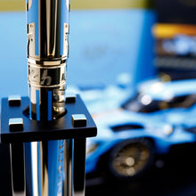 Load image into Gallery viewer, Close up to engraved pen in its trophy stand.