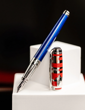 Load image into Gallery viewer, The fountain pen arranged on a white, black, and red display.