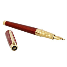 Load image into Gallery viewer, Angled view of the bordeaux fountain pen with the cap set next to it.