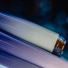 Load image into Gallery viewer, Close up to the shades of blue and white on the cap and barrel.