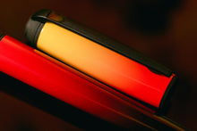 Load image into Gallery viewer, Close up to the red and yellow tones on the barrel and cap.