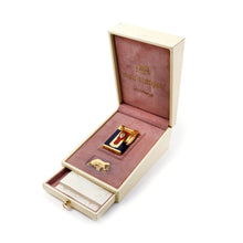 Load image into Gallery viewer, Angled front view of the lighter in its presentation box, with the drawer opened, showing a set of booklets.