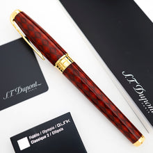 Load image into Gallery viewer, The capped fountain pen, displayed diagonally on a white surface alongside its black branded documentation and cards.
