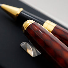 Load image into Gallery viewer, A close-up of the pen's cap, with "lacque de chine" engraved on the gold accent.