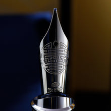 Load image into Gallery viewer, Close up to the golden nib with engraved decorations, a hallmark, 18k, M750