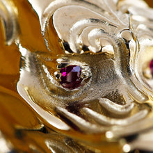 Load image into Gallery viewer, Close up to the red ruby eyes on the dragon.