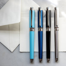 Load image into Gallery viewer, Front view of the turquoise, navy blue, black, and chrome colored pens with the caps on.