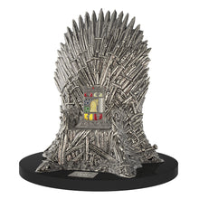 Load image into Gallery viewer, Angled view of the lighter set on its iron throne-shaped stand.