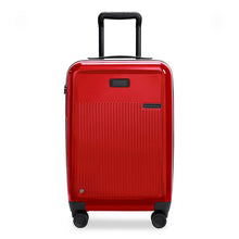 Load image into Gallery viewer, Front panel view of the red carry on suitcase with black accents. The telescopic handle is pulled up.
