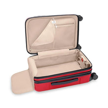 Load image into Gallery viewer, Angled interior view of the red suitcase. It features light tan lining, zipper-closing pockets, and a panel to hold contents.