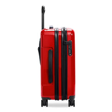 Load image into Gallery viewer, Side panel view of the red suitcase with black accents.