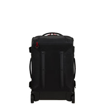 Load image into Gallery viewer, Back panel view of the black suitcase with the telescopic handle tucked into the pocket.