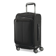 Load image into Gallery viewer, Angled front panel view of the black suitcase with the telescopic handle extended.