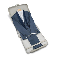 Load image into Gallery viewer, Interior view of the garment bag holding a blue suit.